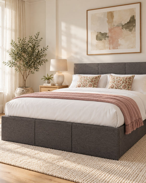 Pimlico side lift ottoman bed in grey hopsack fabric in a bright bedroom (AI-generated illustration of this frame; bedding for illustration, mattress not included)