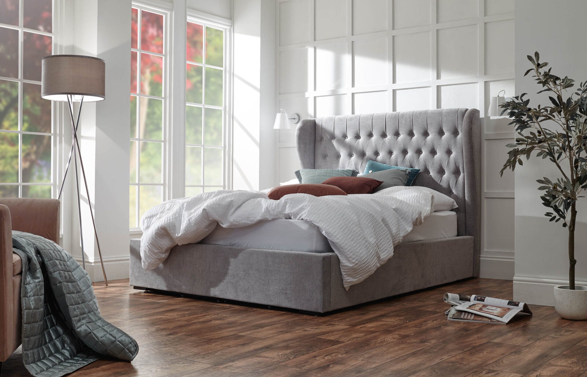 Sloane ottoman bed frame with a tall buttoned headboard in platinum chenille