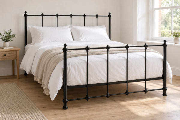 Stockwell black iron bed frame, shown in a bright UK bedroom