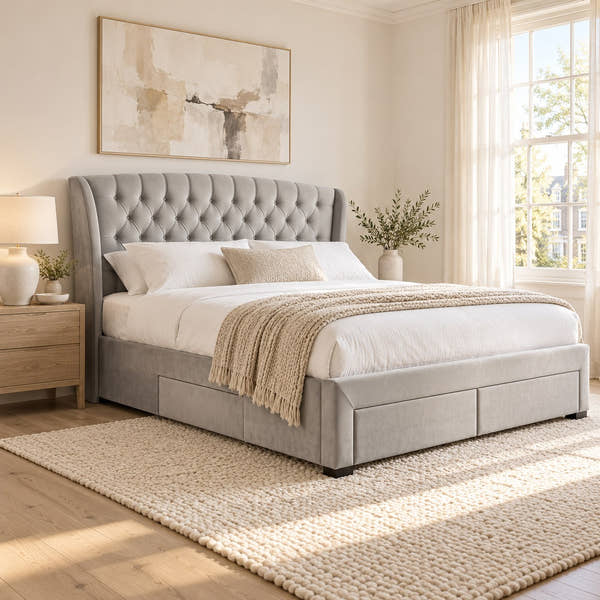 Hendon grey velvet storage bed with 4 drawers and a winged headboard, in a bright bedroom (AI-generated illustration of this frame; bedding for illustration, mattress not included)