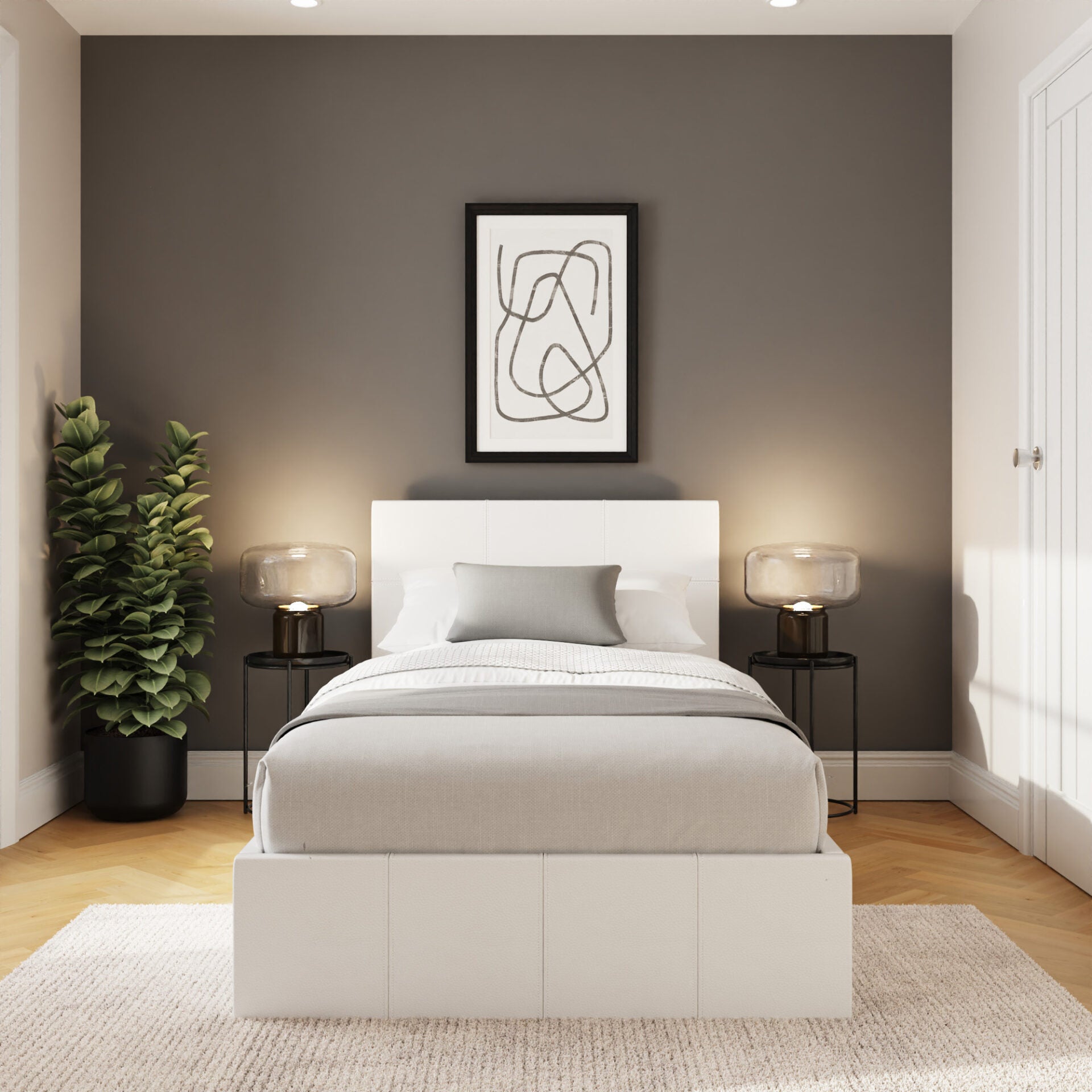 Stratford end lift ottoman bed, in white, in a bedroom with one framed print