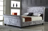Kensington silver crushed velvet sleigh bed in a bedroom