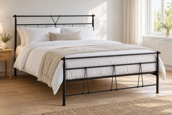 Vauxhall black steel bed frame, shown in a bright UK bedroom