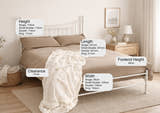 Walthamstow metal bed frame with a low foot end, in ivory, in a bedroom with its height, width and clearance marked