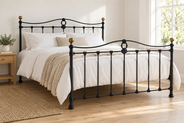 Wapping black iron bed frame, shown in a bright UK bedroom
