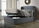Lewisham velvet ottoman bed in grey velvet, with the storage half open