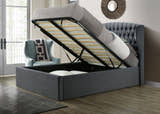 Lewisham velvet ottoman bed in grey velvet, with the gas lift base raised