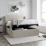 Lewisham velvet ottoman bed in natural velvet, with the storage half open