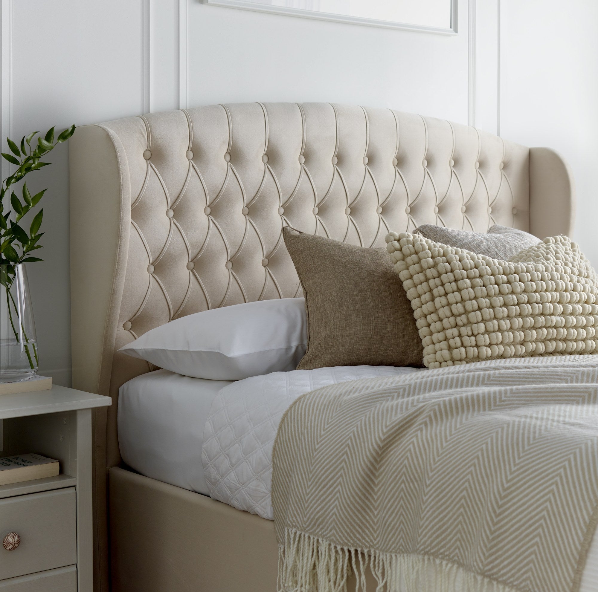 Lewisham velvet ottoman bed in natural velvet, close-up of the headboard