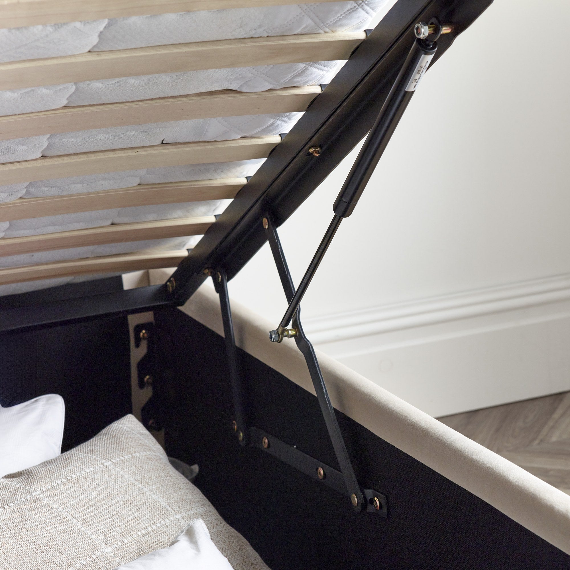 Lewisham velvet ottoman bed in natural velvet, the gas struts under the slatted base