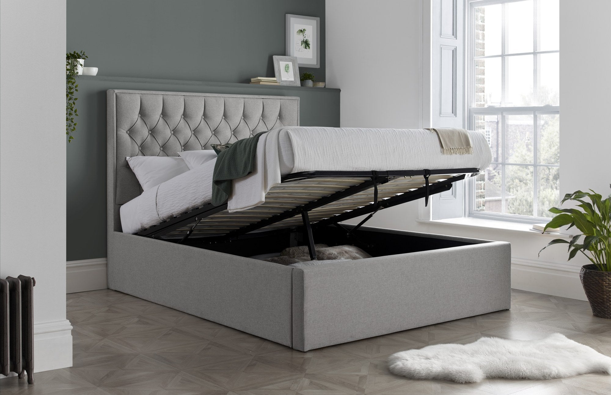 Wembley fabric ottoman bed in grey, with the storage half open