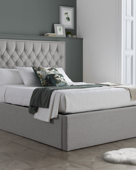 Wembley fabric ottoman bed in grey, closed, in a bedroom