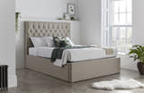 Wembley fabric ottoman bed in oatmeal, closed, in a bedroom