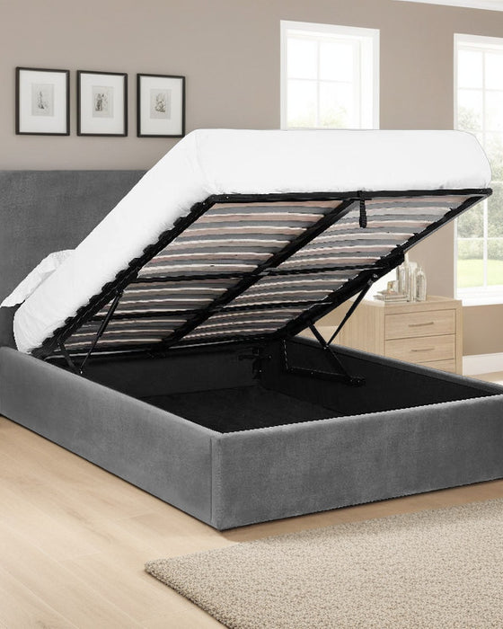 Wimbledon smoked grey velvet ottoman bed, with the storage open, in a bedroom